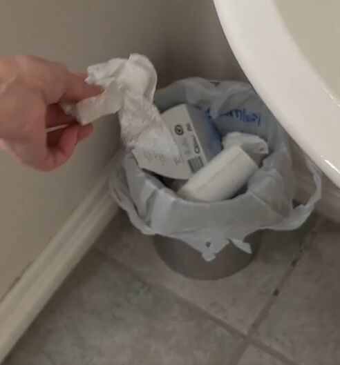 6 dryer sheet hacks the secret to effortless cleaning, Tossing a dryer sheet into a trash can