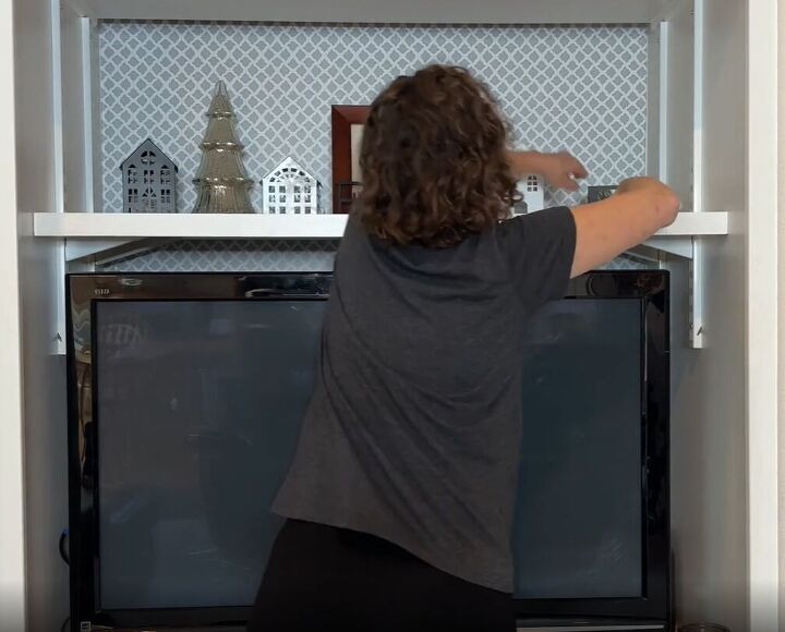 6 dryer sheet hacks the secret to effortless cleaning, Dusting shelves with a dryer sheet