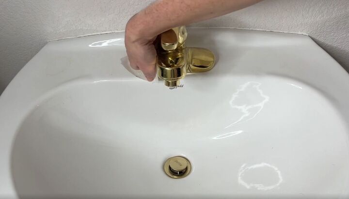 6 dryer sheet hacks the secret to effortless cleaning, Cleaning a faucet and sink with a dryer sheet