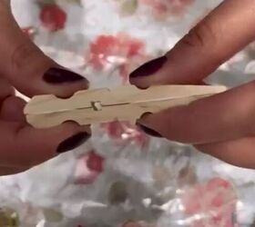 Glue together wooden clothespins to copy this stunning $4 decor idea