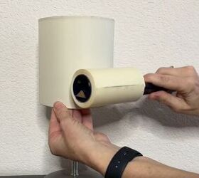 diy dust removal guide how to effortlessly banish dust, Rolling a lint roller on a lamp shade