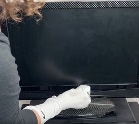diy dust removal guide how to effortlessly banish dust, Cleaning a TV with an old cotton sock