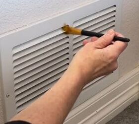 diy dust removal guide how to effortlessly banish dust, Wiping between the slats of a vent with a bristle brush