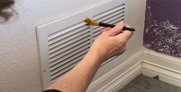 diy dust removal guide how to effortlessly banish dust, Wiping between the slats of a vent with a bristle brush