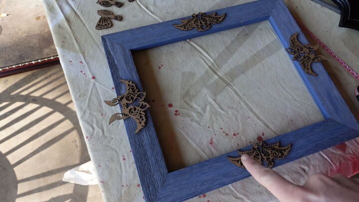 want a glam gold frame gallery wall here s how to diy it, Gluing wood cut birds to the frames