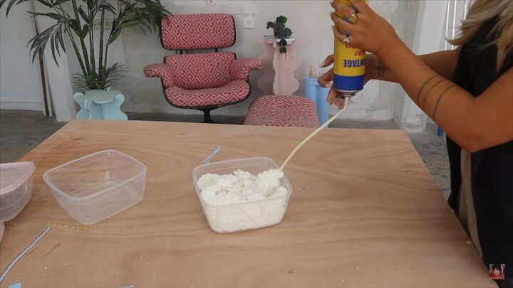 how to make a diy modern coffee table inspired by studio mignone, Filling the food containers with foam sealant