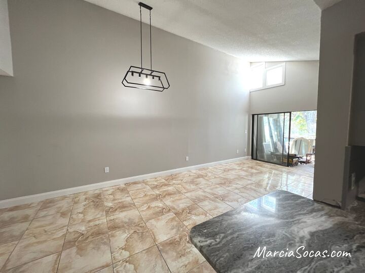 how to create a separate dining area with a beadboard accent wall, Condo with high ceilings