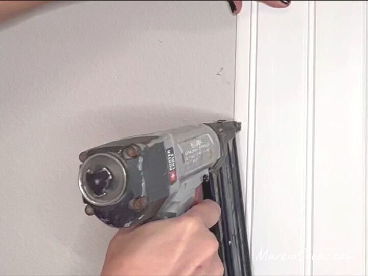 how to create a separate dining area with a beadboard accent wall, Nailing the beadboard panels to the wall