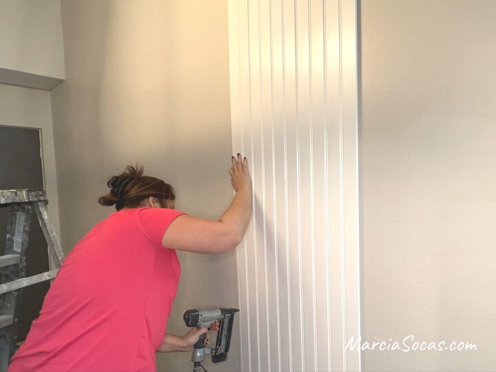 how to create a separate dining area with a beadboard accent wall, Continuing to add the panels