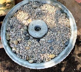 She pours pebbles into an old birdbath for this gorgeous garden idea