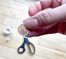 She ties a penny to a few fake flowers for this magical spring decor idea