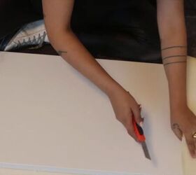 how to make a diy pool noodle headboard in a few easy steps, Trimming the foam with a knife