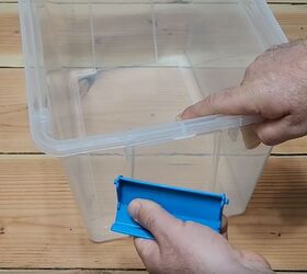 He takes the handles off of plastic dollar store bins for this gorgeous storage hack