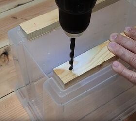 3 easy steps to a stylish diy plastic storage bin makeover, Drilling holes into wood strips for caster wheels