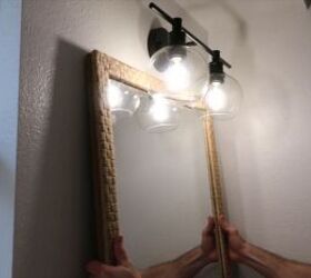 how to totally transform your bathroom in just one weekend, Hanging a new mirror