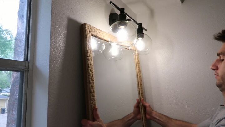 how to totally transform your bathroom in just one weekend, Hanging a new mirror