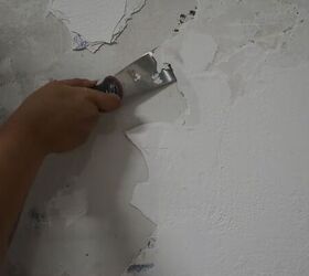 how to create an industrial exposed concrete accent wall for free, Scraping off layers of paint
