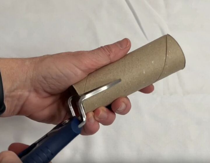 12 amazing hanger hacks to keep your home organized, Cutting a slit down the side of a toilet paper tube
