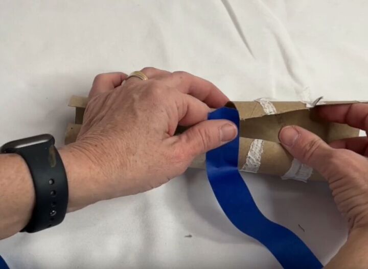 12 amazing hanger hacks to keep your home organized, Taping two rolls of cardboard toilet paper tubes together with duct tape
