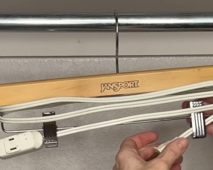 12 amazing hanger hacks to keep your home organized, Clipping the plug end of an electrical cord into a pants hanger