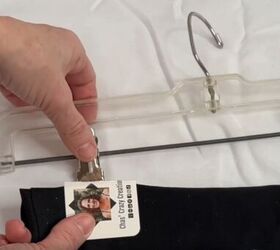 12 amazing hanger hacks to keep your home organized, A folded busines card placed over the top of a pair of pants before attaching it to the clip of a pants hanger