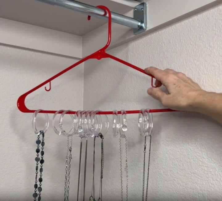 12 amazing hanger hacks to keep your home organized, Necklaces hanging from shower curtain rings attached to a hanger