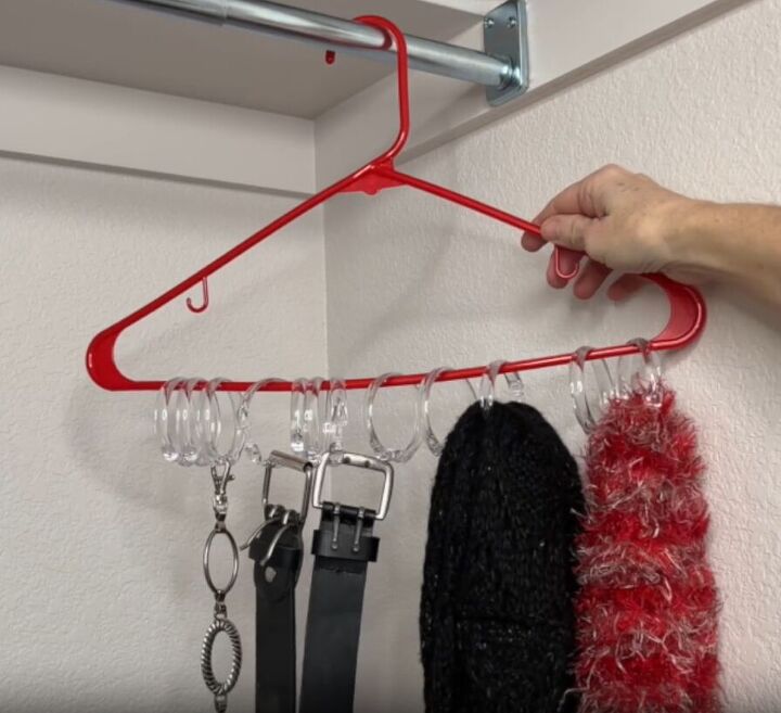 12 amazing hanger hacks to keep your home organized, Scarves and belts hanging from shower curtain rings attached to a hanger