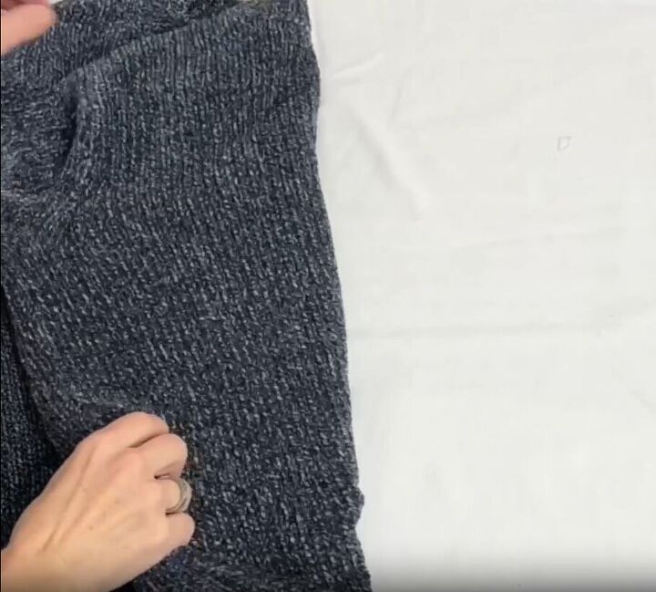 12 amazing hanger hacks to keep your home organized, Folding a sweater in half lengthwise