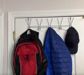coat closet organization how to organize yours like a pro, An over the door rack with a backpack coat and hat hanging from it