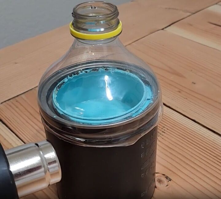 handyman tips 8 home improvement hacks to make your life easier, Molding a plastic bottle lid to the top of a paint can with a heat gun