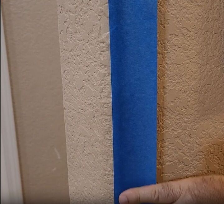 handyman tips 8 home improvement hacks to make your life easier, Sticking painter s tape to a wall