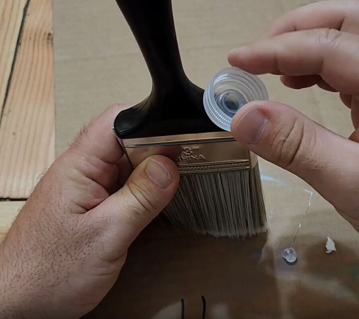 handyman tips 8 home improvement hacks to make your life easier, Sticking a plastic water bottle cap into a drilled hole in a paintbrush