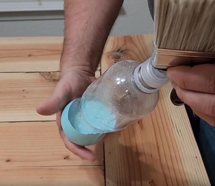handyman tips 8 home improvement hacks to make your life easier, Attaching a plastic bottle filled with paint to a paintbrush