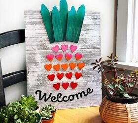 cartel de pia de bienvenida hecho con corazones de madera