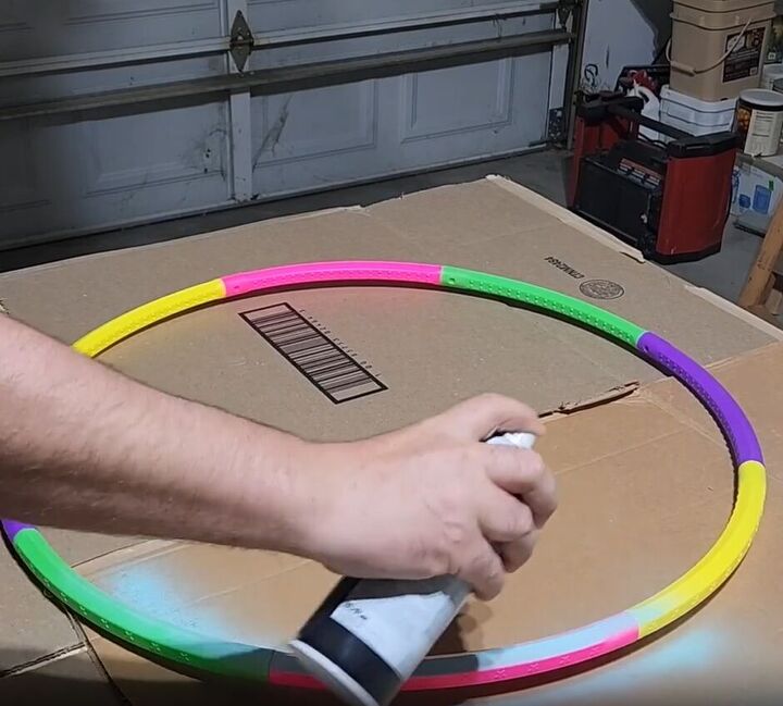 how to make a hula hoop shelf a cute family command center, Spray paint the hula hoops in your favorite color to add a pop of personality to your command center
