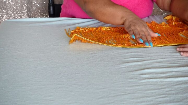 how to make a cute diy fringe lampshade in a few easy steps, Sticking the fringe to the trim