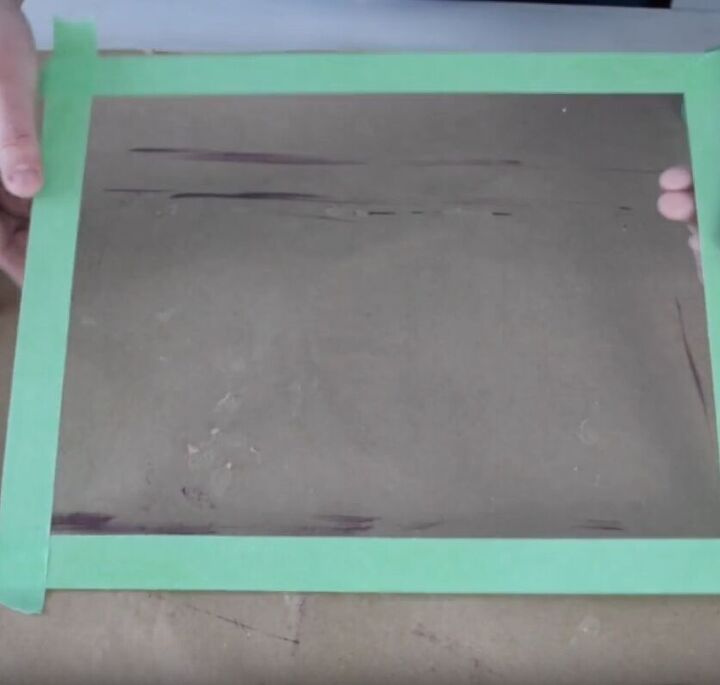 Stick painter’s tape to the glass