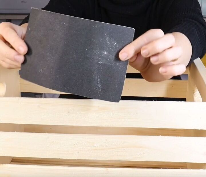 Sand the crates to give the wood a smooth finish