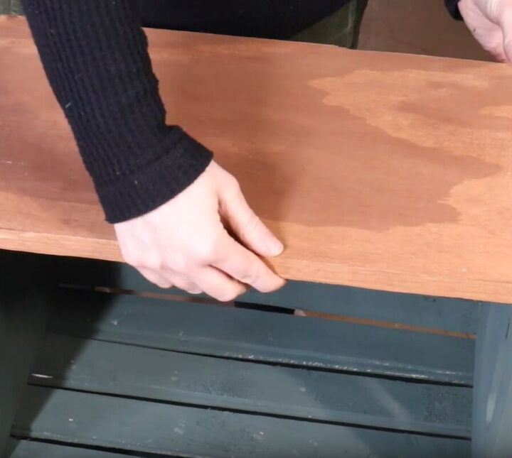 Place the second piece of plywood on top of the shelving unit