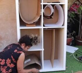 Bending and taping cardboard to make rounded shapes in the shelves