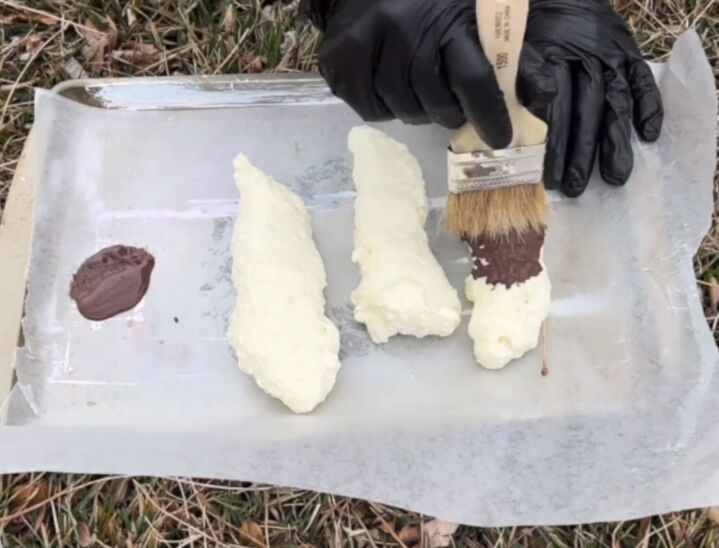 Create fake dog poop from spray foam and paint it