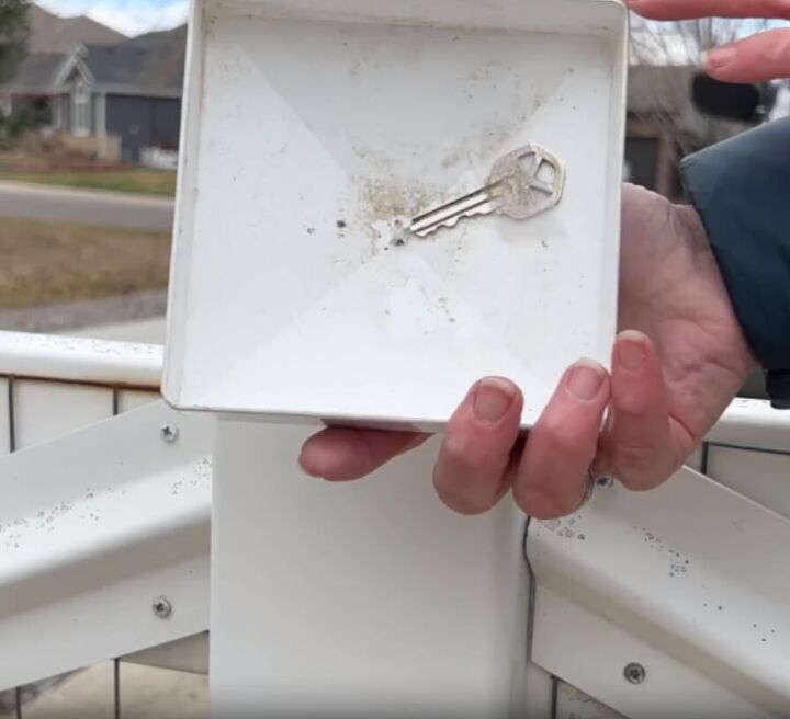 Stick a spare key to the underside of a fence post cap