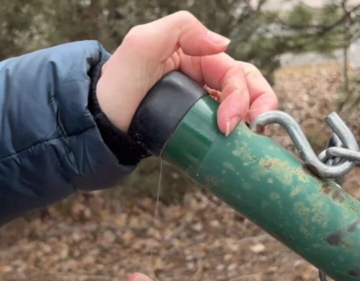 Replace the cap of the pole ensuring some fishing lines is accessible