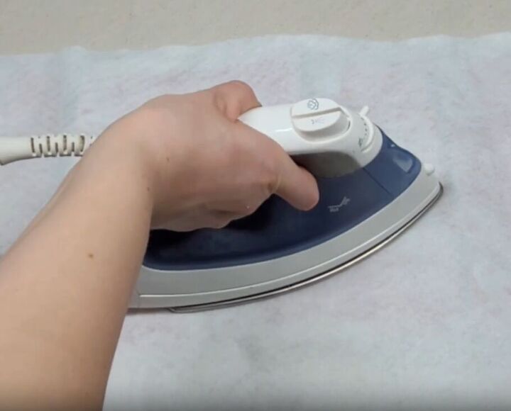 Use an iron to further flatten out the aluminum sheets