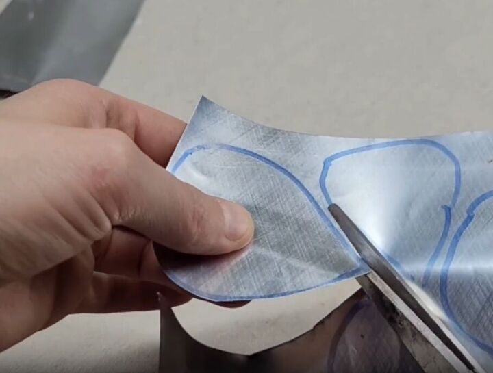 Draw teardrop-shaped leaves on the sheets and cut them out