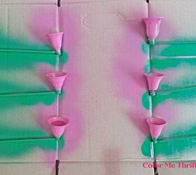 apagavelas reutilizados en flores de jardn, pintar con spray los apagavelas de color rosa y las asas de color verde