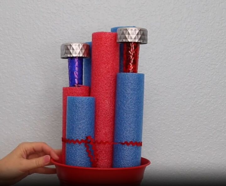 Insert solar lights into 2 pool noodles