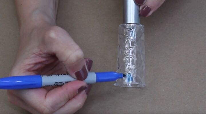 Color in the top of a solar light with a blue Sharpie