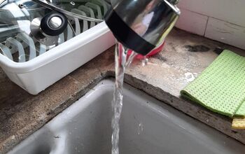 Why is there low water pressure from the kitchen faucet?