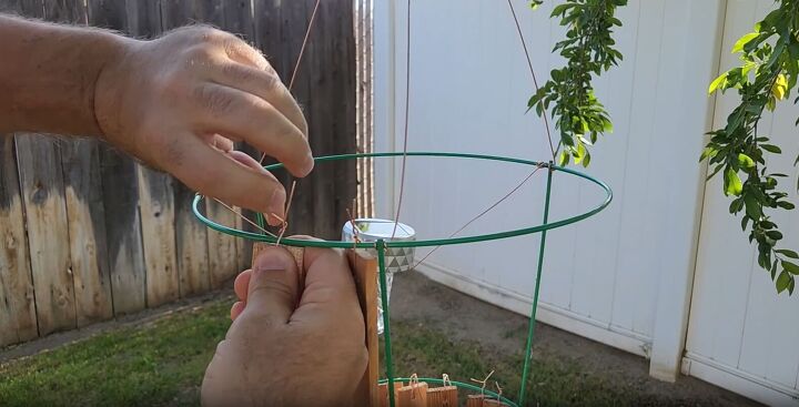 Continue adding shims to the top level of the tomato cage